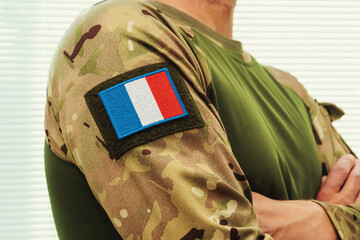 Fototapeta premium Modern military uniform with camouflage and French flag.