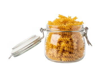 Glass jar filled with golden fusilli pasta against uncooked food