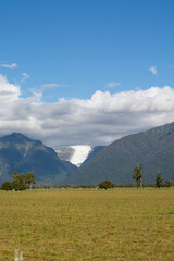 Scenic Mountain Landscape with Glacier and Blue Sky