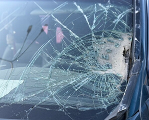 Car accident crash shuttered cracked broken damaged windshield at driver side. Dangerous, careless, unsafe, drunk, impaired driving, DUI, car crash fatal injury, insurance claim concept.