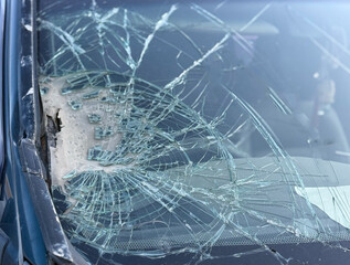 Car accident crash shuttered cracked broken damaged windshield at driver side. Dangerous, careless, unsafe, drunk, impaired driving, DUI, car crash fatal injury, insurance claim concept.