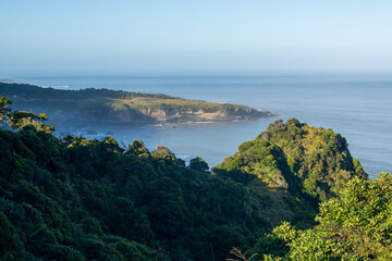 Scenic Coastal View with Lush Green Hills