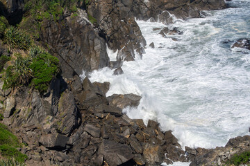 Waves Crashing on Rugged Coastal Rocks