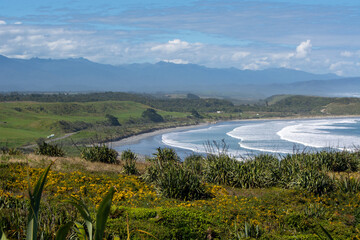 Scenic Coastal Landscape with Waves and Mountains