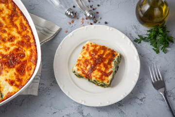 Baked Spinach with cheese delicious Italian food cuisine. Spinach gratin.