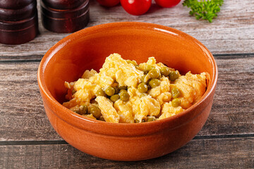 Scrambled egg omelet with green peas