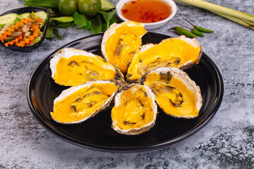 Baked oyster with cheddar cheese