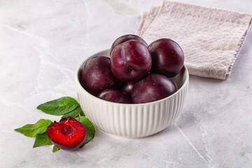 Raw ripe purple plum heap