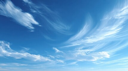 A serene scene of clear blue skies with wispy white clouds peacefully drifting in the airy atmosphere creating a tranquil copy space image