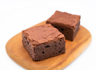 Fudgy Chocolate Brownies on Wooden Board side view of Indulgent Dessert
