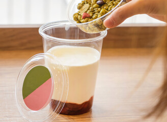 Strawberry Greek Yogurt Cup with Matcha Granola side view of Healthy Snack