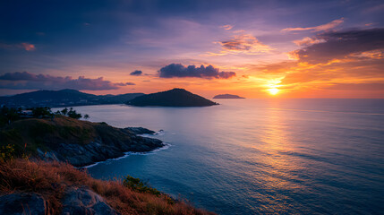 Fototapeta premium Scenic Coastal Sunset with Golden Sky Reflections Over Calm Ocean Waters
