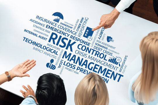 This image showcases a collaborative risk management session focusing on assessment, control strategies, and emergency preparedness, highlighting teamwork and effective planning. Amity