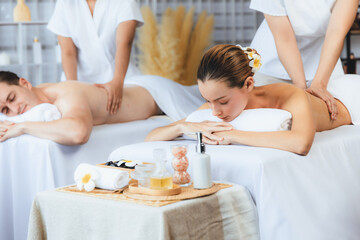 Caucasian couple customer enjoying relaxing anti-stress spa massage and pampering with beauty skin...