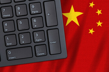 Computer keyboard on a Chinese flag