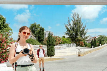 Smiling Woman Takes Travel Selfie Photo with Camera on Sunny Vacation
