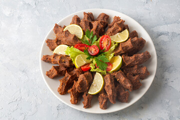Traditional delicious Turkish food; Turkish name; Cig kofte (raw meatball in Turkish) with lettuce