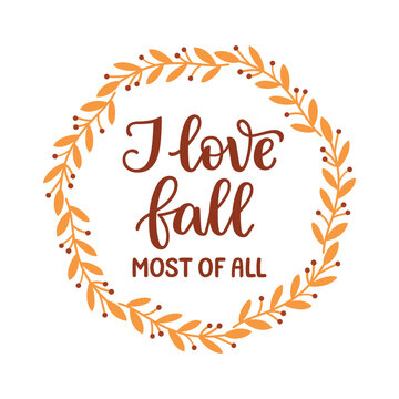 I love fall most of all hand lettering composition in a wreath of branches with yellow leaves and berries