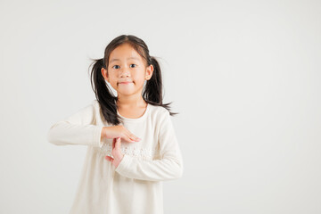 Closeup portrait young kid girl smiling making give time out gesture with hands studio shot...