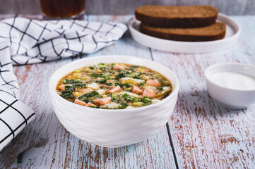 Traditional cold vegetable soup with kvass in a bowl on the table