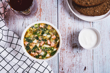Traditional cold vegetable soup with kvass in a bowl on the table top view