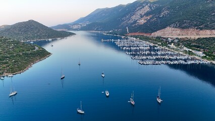 Coastal mountain landscape, sea resort yachts, golden hour