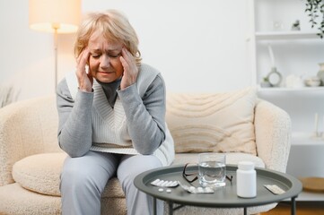 Senior woman suffering from a headache
