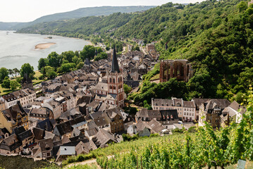 View from the vineyards of the historic Old Town with its half-timbered houses. View of the Rhine River, Bacharach, Hesse, Germany