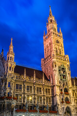 Fototapeta premium View at dusk of the Munich town hall, Bavaria, Germany, neo-Gothic building
