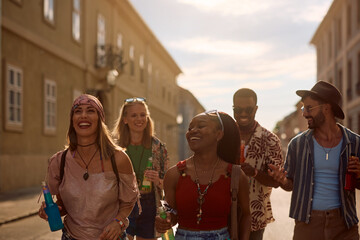 Group of happy festival goers going to open air music concert.