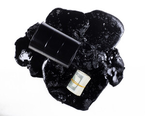business concept,Black barrel with spilled oil isolated on white background