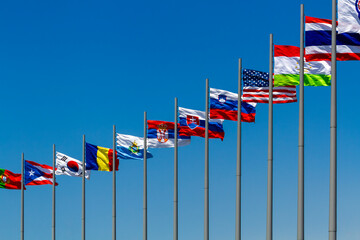 flags of countries against blue sky