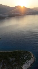 Boats coastal town. Coastal mountain landscape, sea resort yachts, golden hour