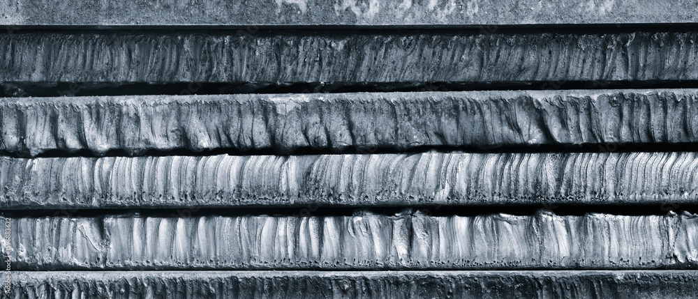 Poster stack of metal sheets with rust. plates are stacked on top of each other and have traces of laser pl