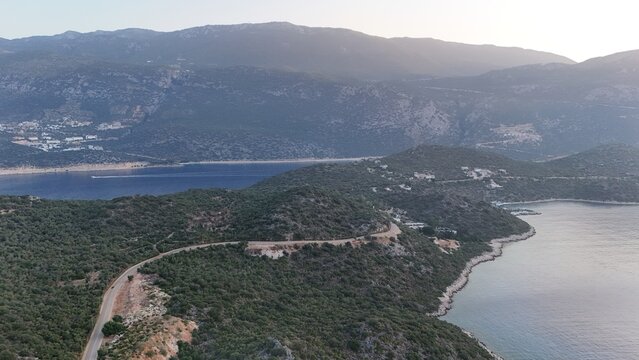 Coastal mountain landscape, sea resort yachts, golden hour - Powered by Adobe