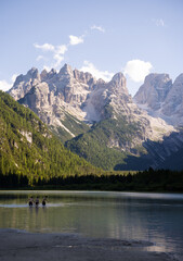 Tourists taking a swim in Lago di Landro, Italy