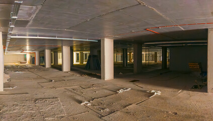 Underground parking under construction. Unfinished underground car park
