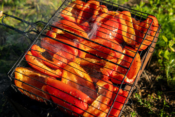 Red bell peppers with spices on the grill. The grill pan