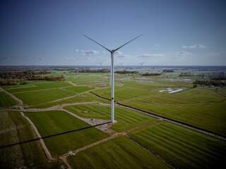 Aerial view of a wind turbine in a flat landscape near the North Sea, wind energy, renewable energies, energy transition, climate protection
