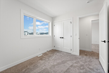 Bedroom with a window and a door