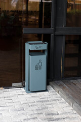 a trash can combined with a cigarette ashtray