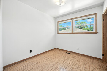 Room with a window and a white wall