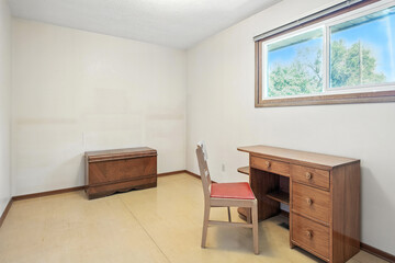 Small room with a wooden desk and chair