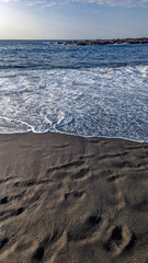 Playa de la Arena, Canary Islands, Tenerife, Spain. Beach with black volcanic sand. Atlantic coast.