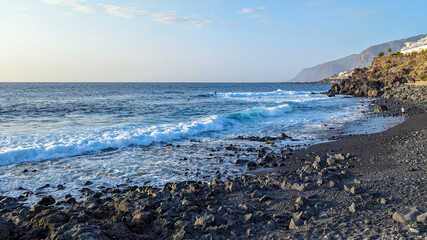 Play del volcan. Canary Islands, Tenerife, Spain. Beach with black volcanic pebble, sand and stones.
