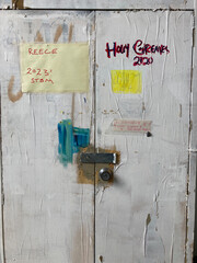 Old metal cupboard covered in paint in an art studio