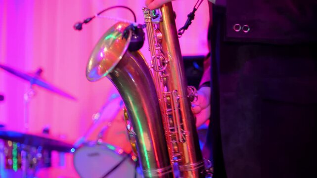 Professional Musician is playing a saxophone on Stage.