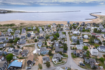 aerial view of the river at a beach with homes