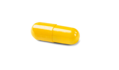 yellow pill capsule isolated on white background