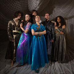 Middle Eastern fantasy concept with models in elaborate Turkish attire, storybook composition.